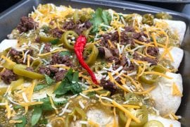 Ground Pronghorn Enchiladas with Black Beans and Pickled Jalapenos smothered in Roasted Tomatillo Salsa