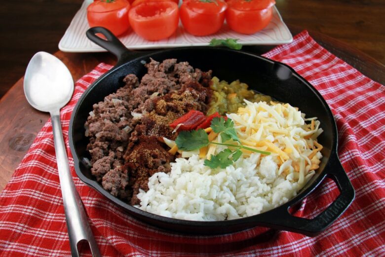 Elk Recipes & Wild Game Cooking Ideas - Baked stuffed tomatoes filled with elk and rice on a serving plate